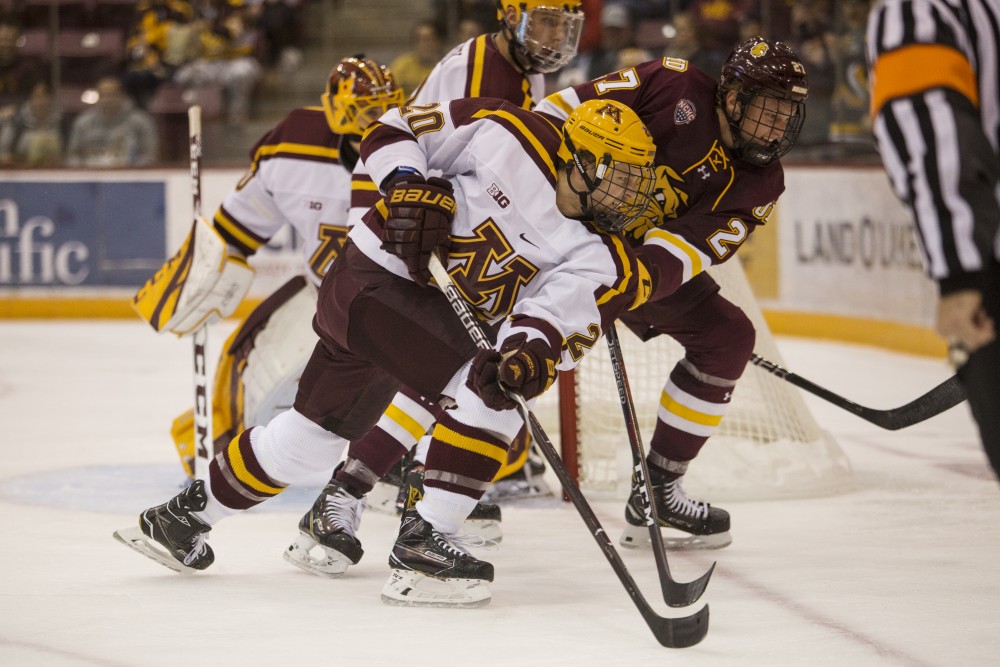 Junior Ryan Zuhlsdorf skates past the University of Minnesota Duluth toward the puck during the game on Sunday, Oct. 7 at Mariucci Arena. The Gophers won 7-4.