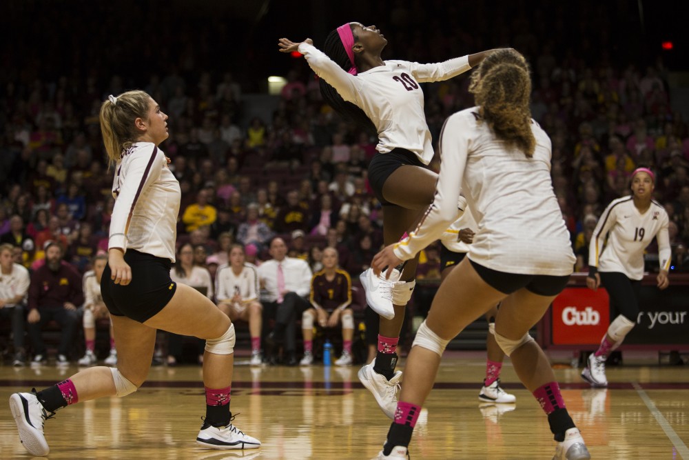 Freshman outside hitter Adanna Rollins jumps to spike the ball during the game against the Northwestern Wildcats on Saturday, Oct. 13. The Gophers beat Northwestern in all three sets.