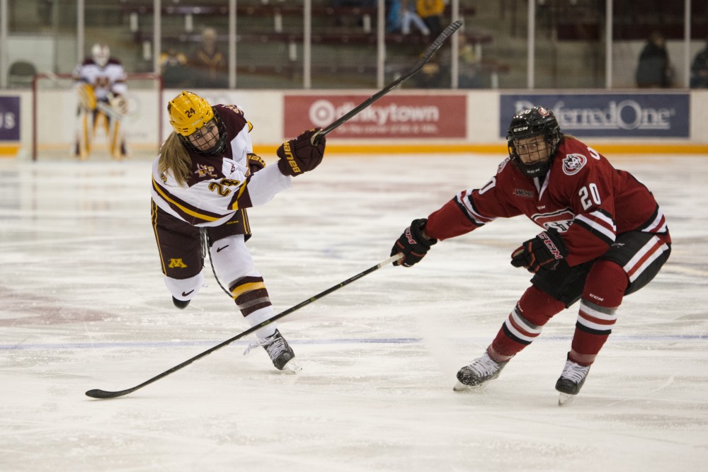 Defender Olivia Knowles looks to shoot the puck on Saturday, Oct. 13, at Ridder Arena. The Gophers beat St. Cloud State 4-1.
