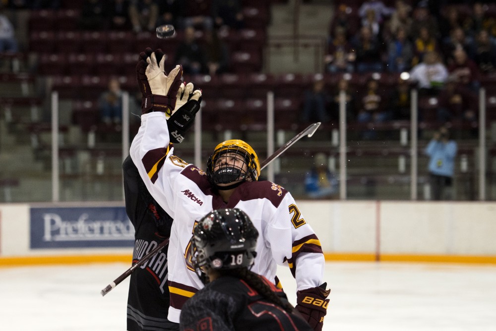 Forward Emily Oden reaches up to grab the puck at Ridder Arena on Friday, Oct. 19. 