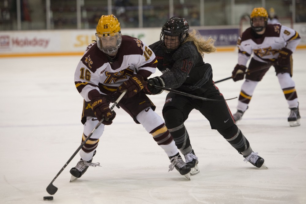 Forward Amy Potomak fights for the puck at Ridder Arena on Friday, Oct. 19. The Gophers beat Ohio State 3-0. 