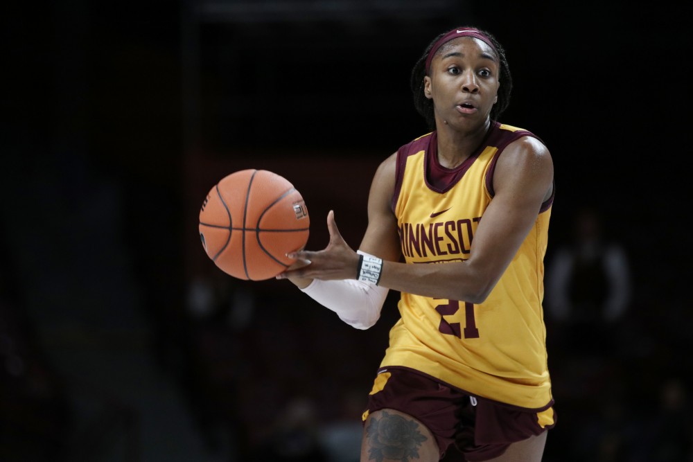 Guard Jasmine Brunson passes the ball during Gopher womens basketballs annual exhibition versus the mens scout team on Saturday, Oct. 20 at Williams Arena.