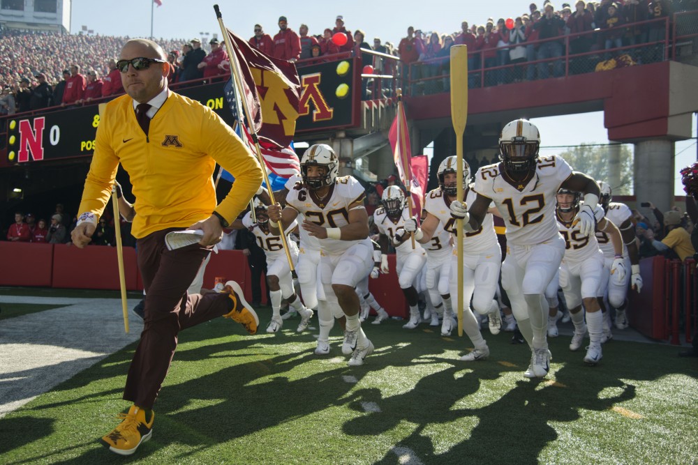 Head Coach P.J. Fleck leads the Gophers onto the field on Saturday, Oct. 20 at Memorial Stadium. Nebraska defeated the Gophers with a final score of 53-28.