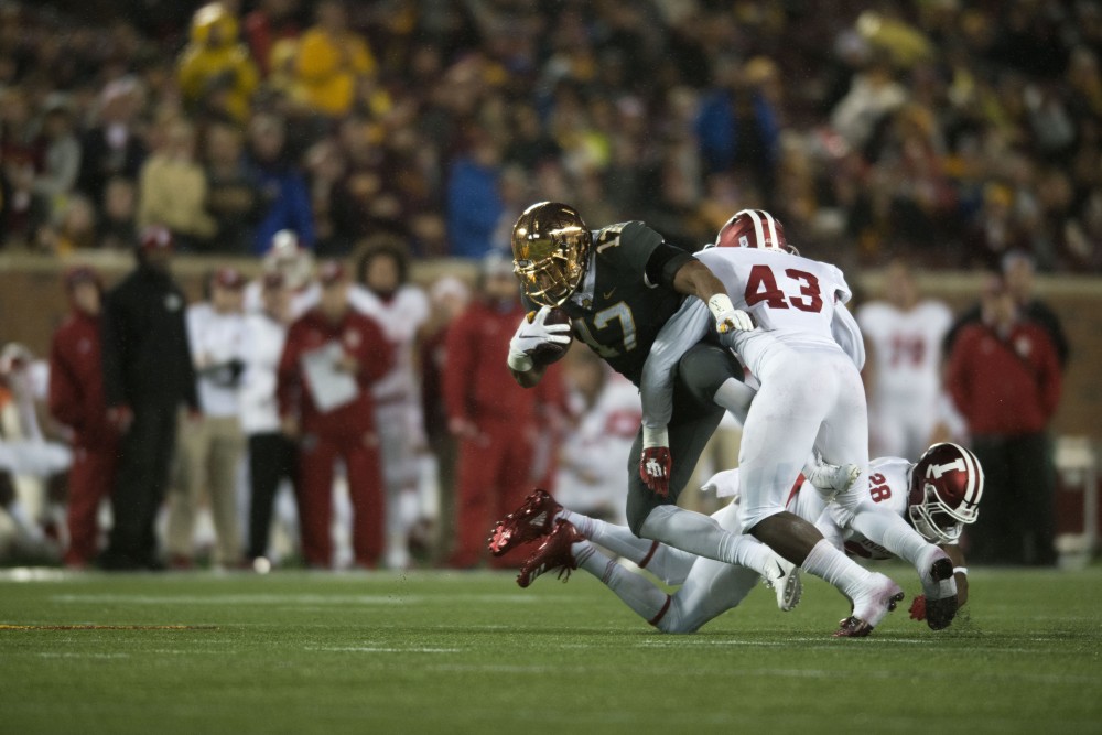 Wide receiver Seth Green works to avoid a tackle from Indiana on Friday, Oct. 26 at TCF Bank Stadium.