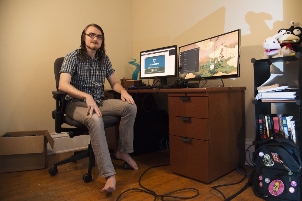 Noah Wrolson poses at his desk before a game of Overwatch with the University ESports team on Sunday, Oct. 28. Wrolson doesnt play sports, so he said he fills a competitive void by participating in the ESports team.