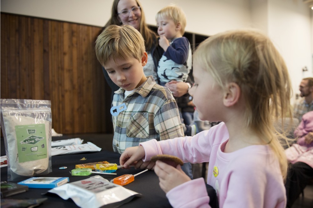 Charlotte and Graham Paulsen examine mealworm and scorpion lollypops on Sunday, Oct. 7. as part of Food Fest at the newly opened Bell Museum in Saint Paul. Sujaya Raos presentation, which examined bugs as a sustainable source of protein, encouraged the audience to try samples. 