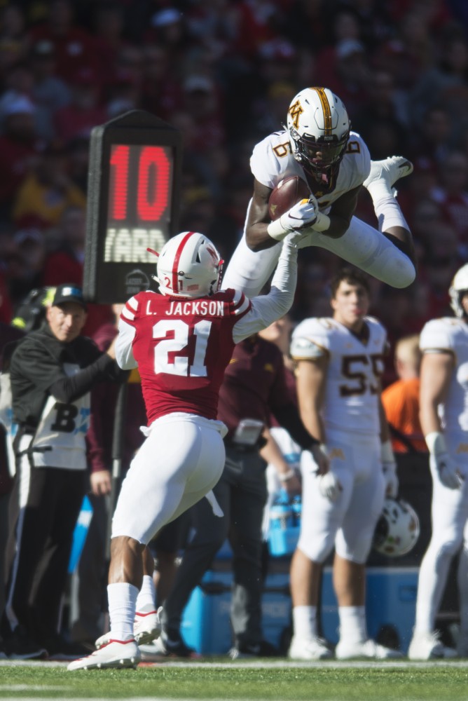 Wide receiver Tyler Johnson jumps to catch a pass on Saturday, Oct. 20 at Memorial Stadium. Nebraska defeated the Gophers with a final score of 53-28.

