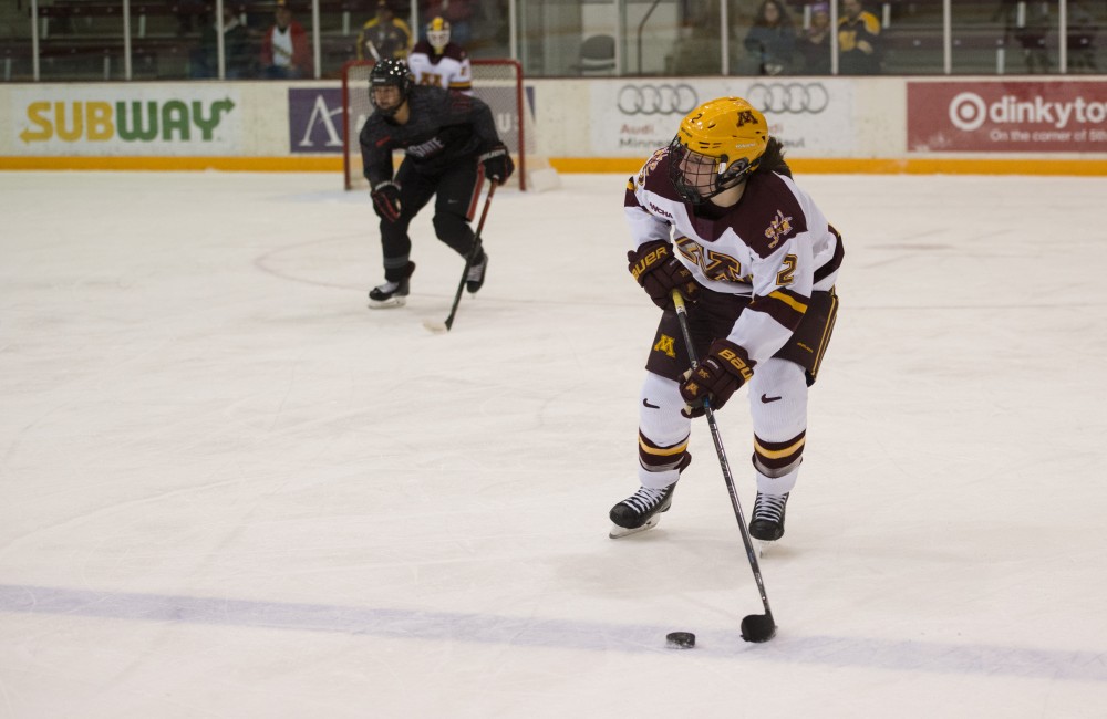 Defender Emily Brown looks to pass the puck up the ice at Ridder Arena on Friday, Oct. 19. The Gophers beat Ohio State 3-0. 