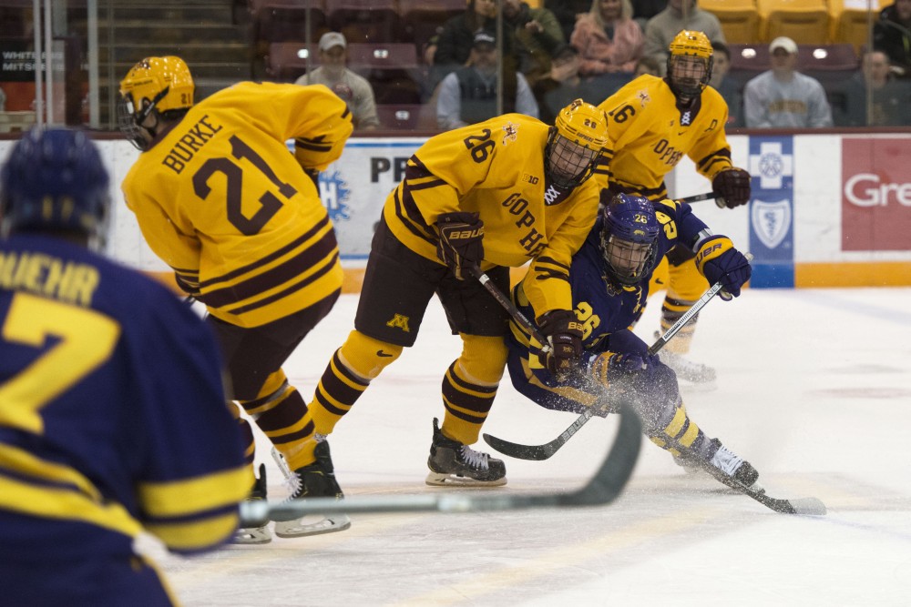 Forward Darian Romanko fights for the puck at 3M Arena at Mariucci on Friday, Nov. 2. The Gophers fell to Minnesota State with a final score of 5-1. 