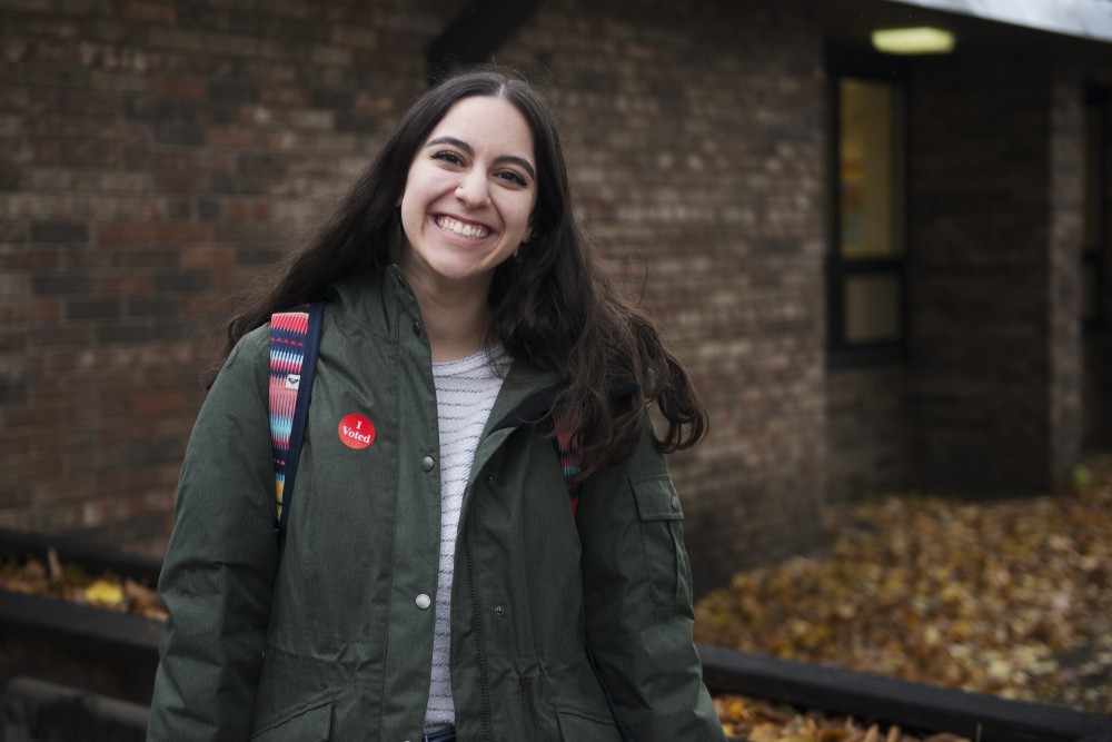 University of Minnesota art history senior Olivia Nokovic poses for a portrait after voting at Van Cleve Park on Tuesday, Nov. 6. Nokovic is a teaching assistant at the University, and shes been advocating for her students to vote. 