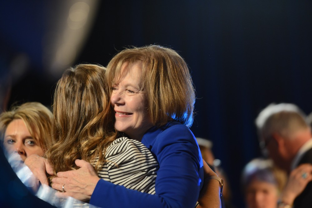 Tina Smith hugs a supporter during the DFL election party in Saint Paul on Tuesday, Nov. 6.