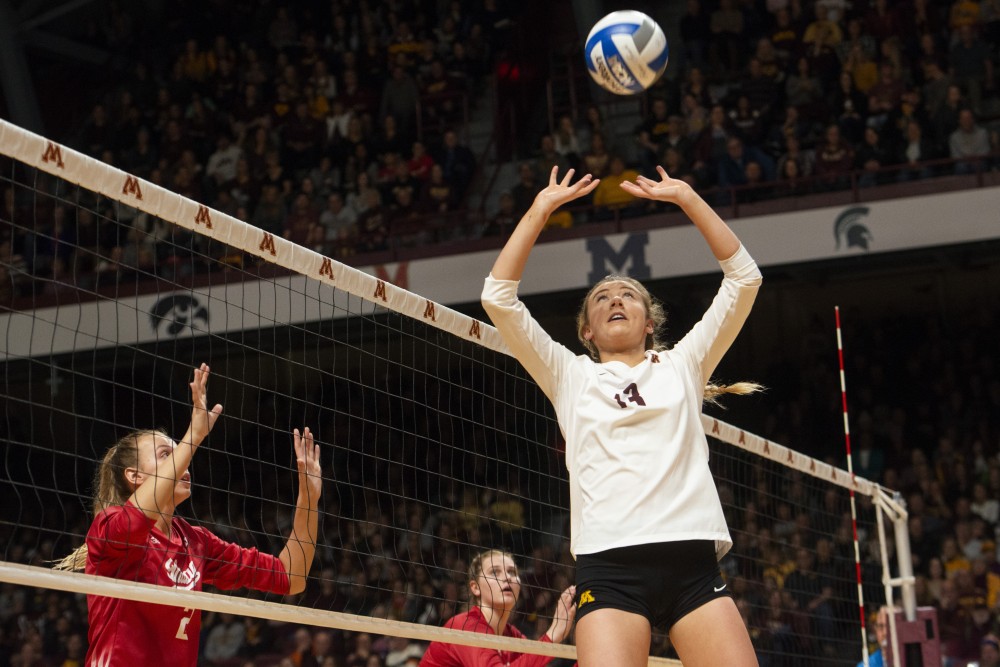 Samantha Seliger-Swenson sets the ball during the game against Indiana on Friday, Nov. 9 at Maturi Pavilion.