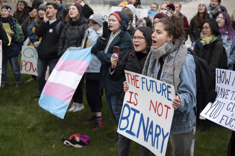 University of Minnesota student Laïla Bensaad chants during a transgender march on West Bank on Thursday, Nov. 8. The march started near Dinkytown and went across the Washington Avenue Bridge before ending outside of the Humphrey School of Public Affairs.