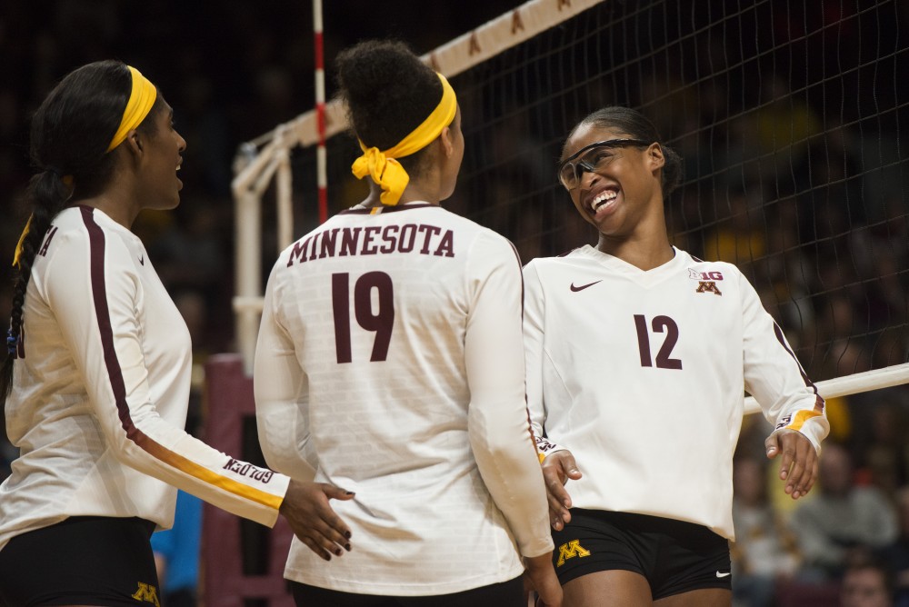 Redshirt Junior Taylor Morgan smiles after scoring a point at Maturi Pavilion on Friday, Nov. 9. The Gophers swept Indiana in all three sets.