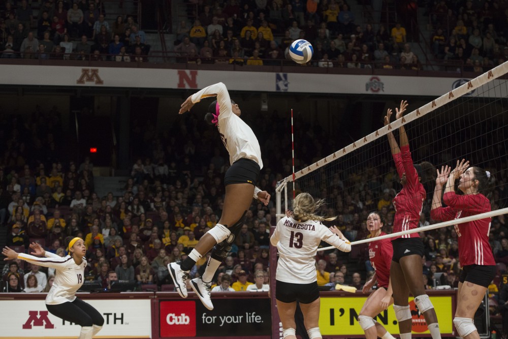 Redshirt Junior Taylor Morgan jumps to spike the ball at Maturi Pavilion on Friday, Nov. 9. The Gophers swept Indiana in all three sets.