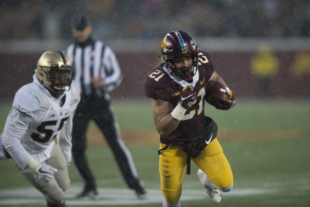 Runningback Bryce Williams runs towards the end zone for a touchdown on Saturday, Nov. 10 at TCF Bank Stadium. The Gophers beat Purdue 41-10. 