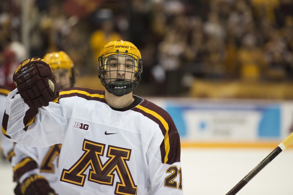 Freshman Nathan Burke skates back to the bench after scoring his first goal of the season at Mariucci Arena on Saturday, Nov. 17. 