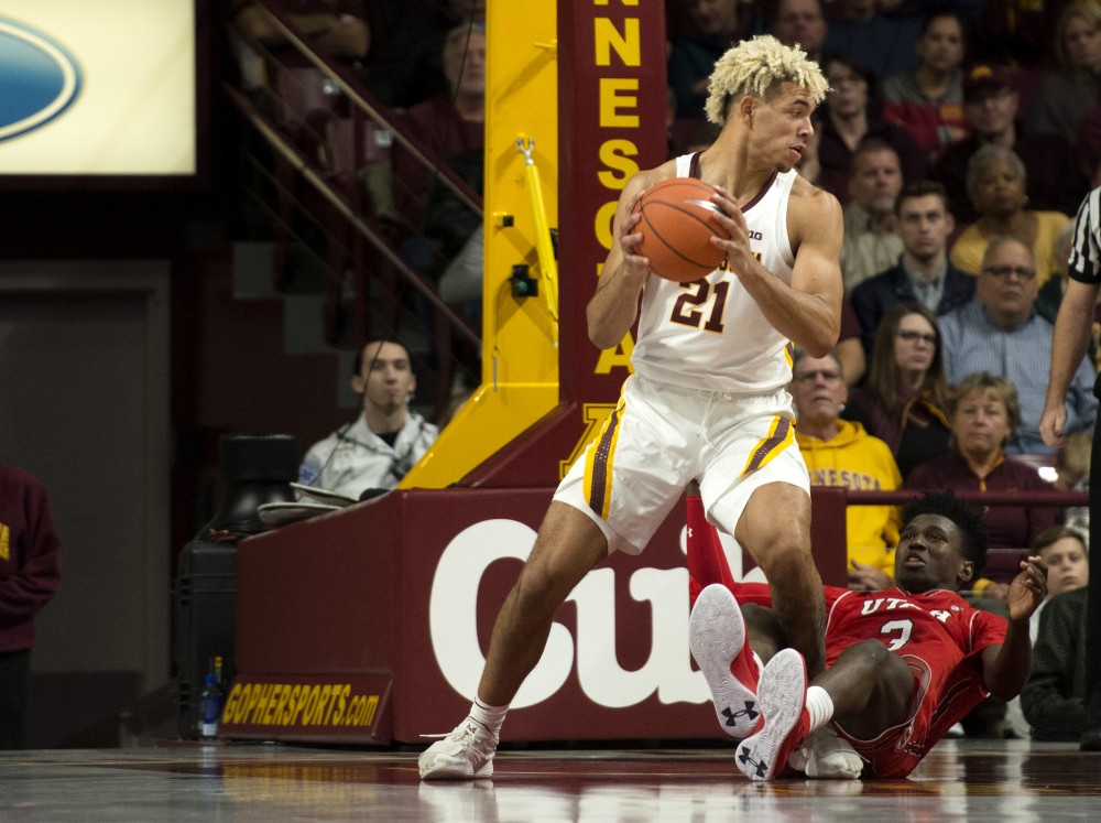 Freshman Jarvis Omersa keeps the ball away from Utah on Monday, Nov. 12, 2018 at Williams Arena. 