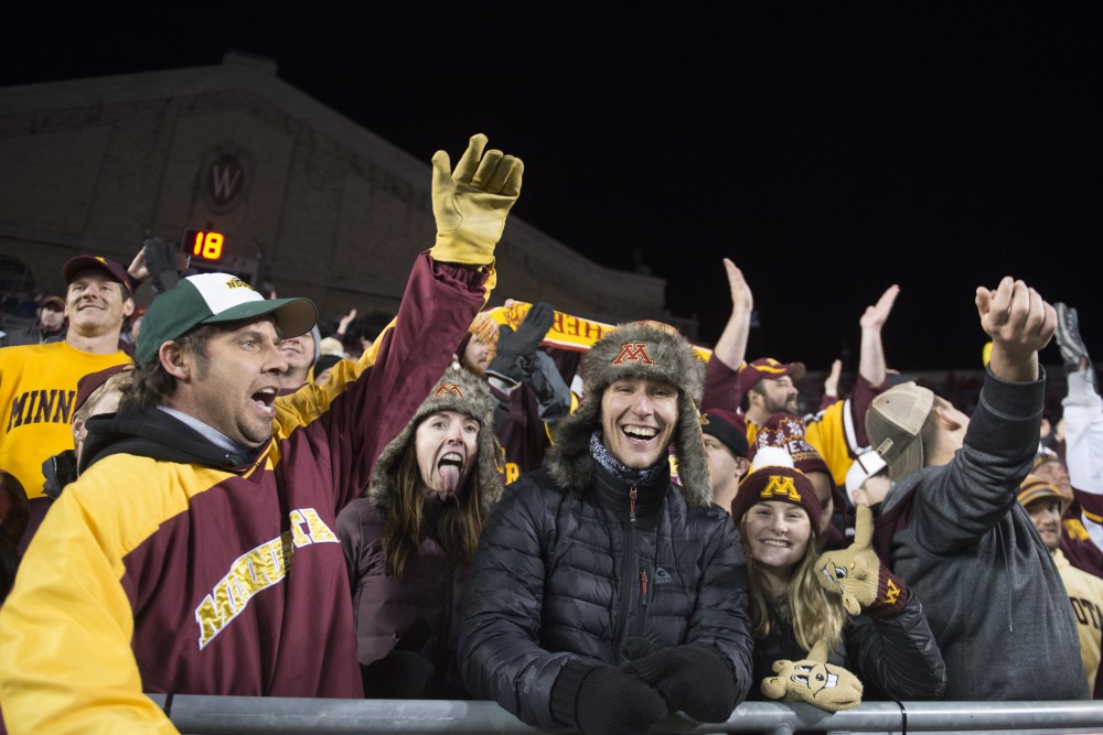 Gopher fans appeared in droves in the front row as Badger fans left at Camp Randall Stadium in Madison on Saturday, Nov. 24. The Gophers beat the Badgers 37-15 for the first time since 2003.