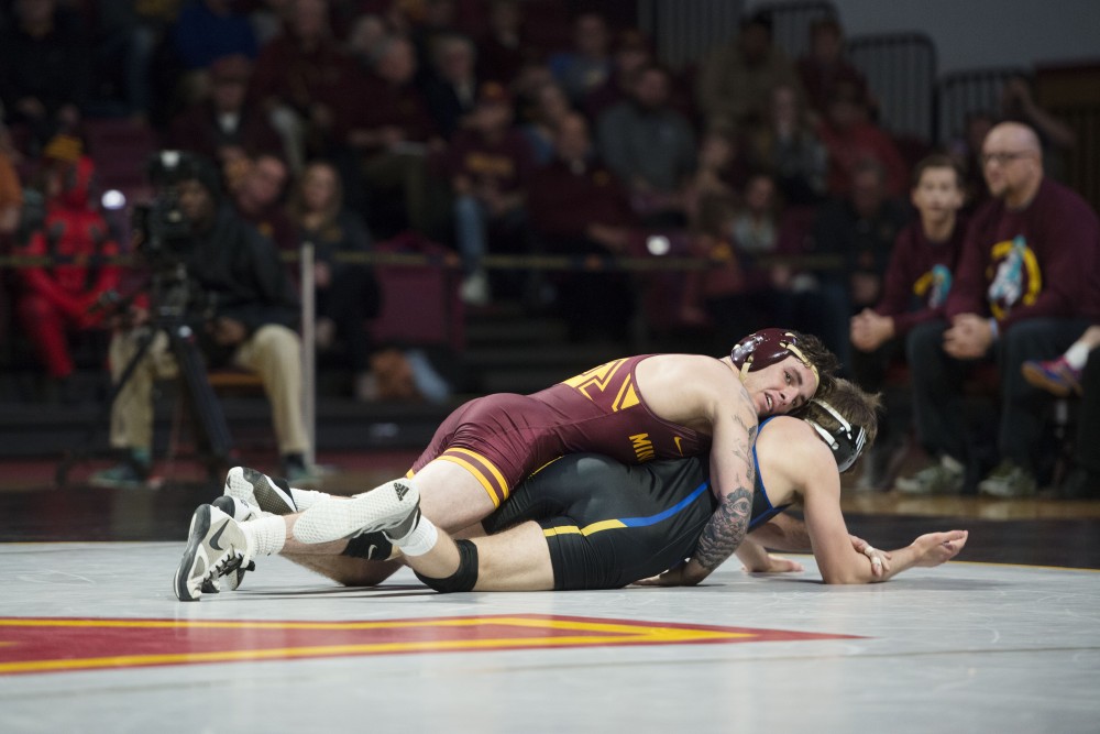 Redshirt senior Sean Russell at 125 competes during the match against South Dakota State on Sunday, Nov. 25, 2018 at Maturi Pavilion.