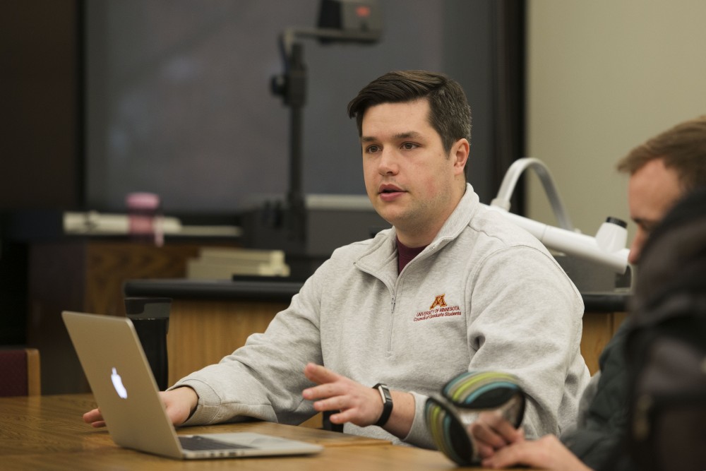 Harrison Frisk speaks during the Council of Graduate Students meeting on Monday, Nov. 26 in Saint Paul. 