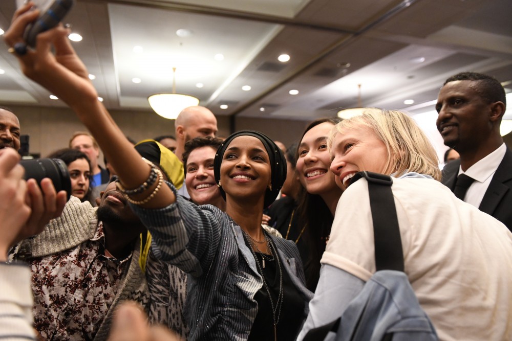 Fifth congressional district seat winner Ilhan Omar takes a selfie with supporters at her election party on Tuesday, Nov. 6 at the Courtyard by Marriott in downtown Minneapolis. 