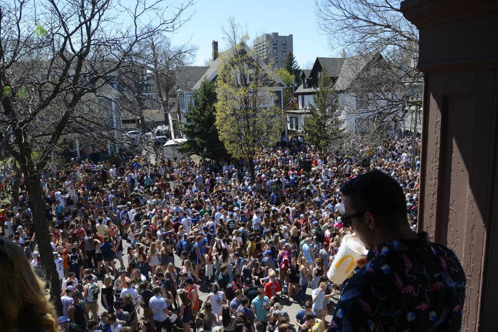 Kinesiology senior Jared Antilla watches over the crowd from a balcony at the Sssdude-Fest Block Party on Saturday, April 22, 2017. I havent seen anything like this in three years, Antilla said. All the homemade parties get broken up. 