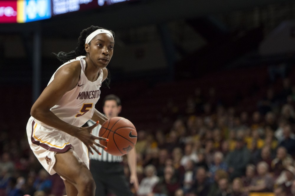 Junior Taiye Bello dribbles around the defender at Williams Arena on Tuesday, Nov. 20. The Gophers beat the Arkansas-Pine Bluff Golden Lions 84-42. 