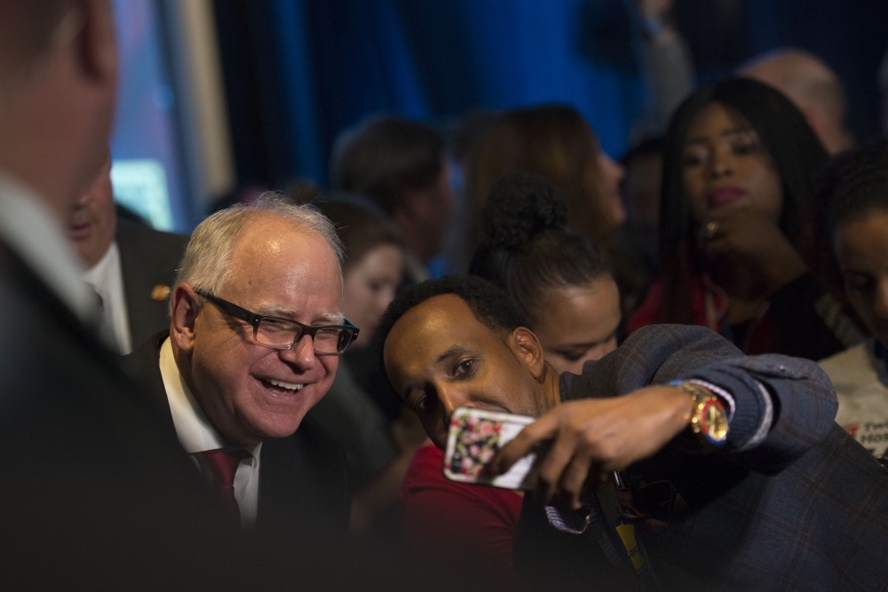 Newly-elected Governor of Minnesota Tim Walz takes a selfie with a supporter at Intercontinental Saint Paul Riverfront Hotel in Saint Paul on Tuesday, Nov. 6.
