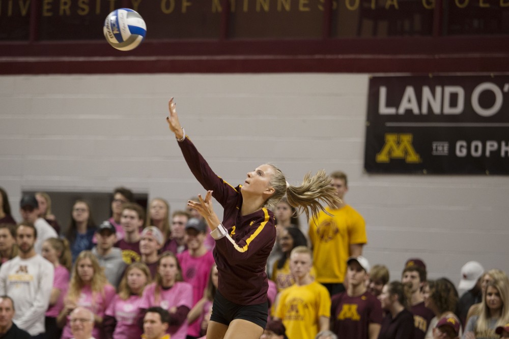 Freshman libero CC McGraw serves the ball during the game against the Northwestern Wildcats on Saturday, Oct. 13. The Gophers beat Northwestern in all three sets.