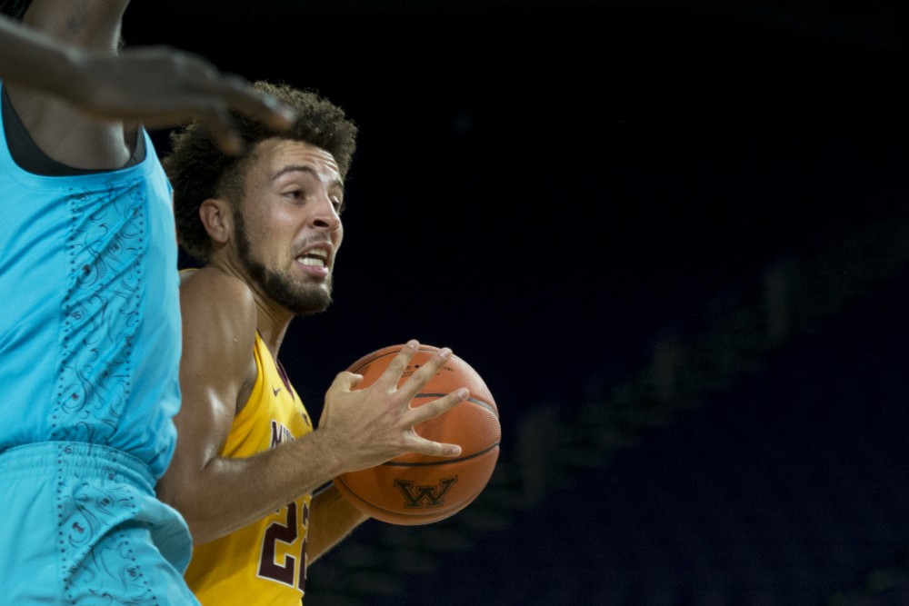 Freshman Gabe Kalscheur drives to the basket at U.S. Bank Stadium in Minneapolis on Friday, Nov. 30. The Gophers beat the Oklahoma State Cowboys 83-76.