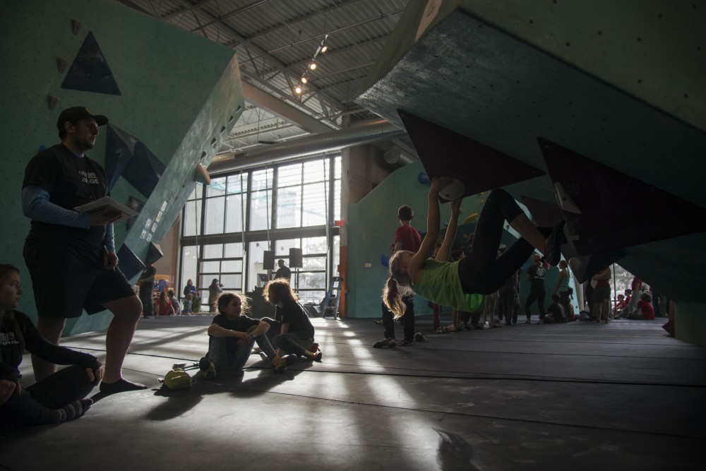 Eva Eakin watches another competitor during the youth competition of Boulderfest North on Saturday, Nov. 10 at the Minneapolis Bouldering Project. Boulderfest North was the climbing gyms first competition following its opening in 2017.
