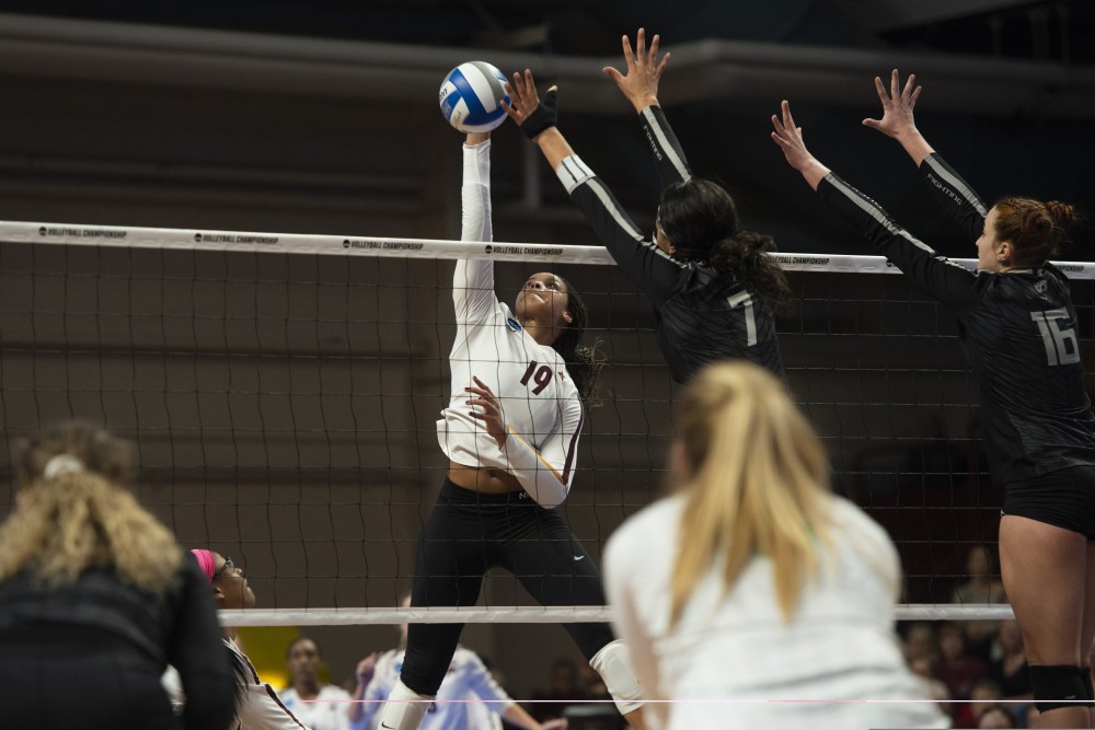Outside hitter Alexis Hart jumps to spike the ball at the Maturi Pavilion on Friday, Dec. 7 2018. The Gophers were upset by number fifteen seed Oregon, losing 3 sets to 1. 