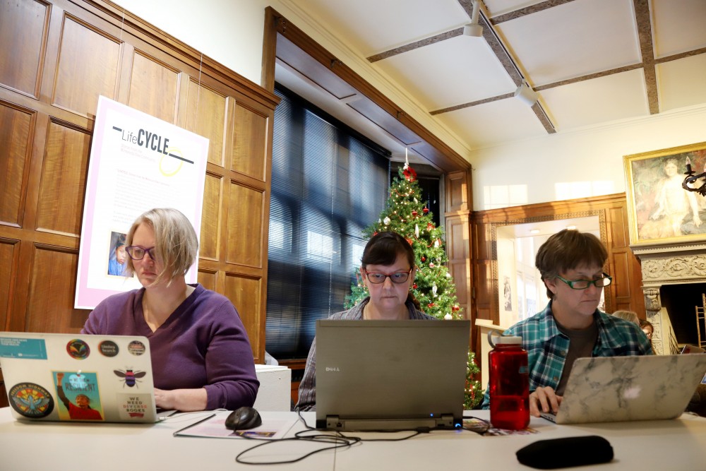 Kim Doyle, Becah Padilla and Martha Hardy research for the Mapping Prejudice Plan on Sunday, Dec. 9 at the Hennepin History Museum in Minneapolis. Part of their job is to find out how the plan will effect the Minneapolis 2040 plan. 