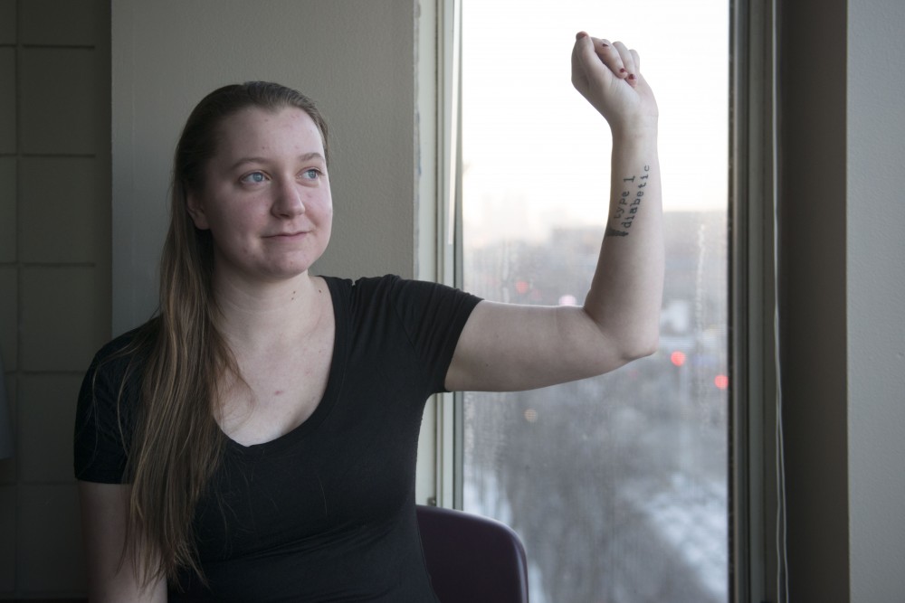 Type 1 diabetic Anna Ribbens poses in her apartment on Sunday, Dec. 9. 