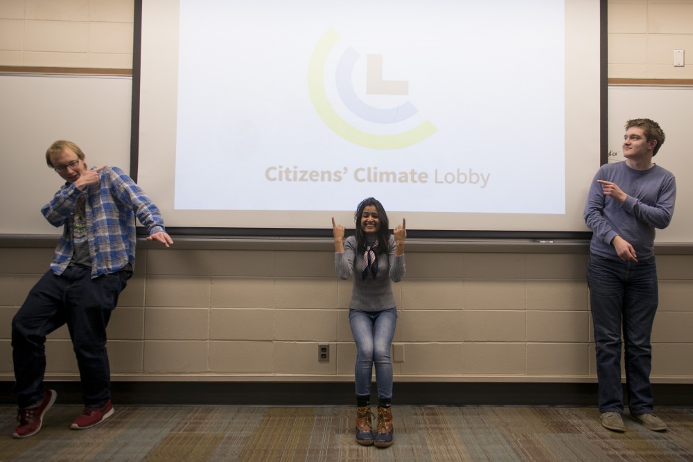 Calvin McMahon, Savita Sidhu and Sean Labor of the Citizens Climate Lobby pose for a group picture before their weekly meeting on Tuesday, Dec. 5. Their small group advocates for the adoption of carbon pricing throughout the university community. 