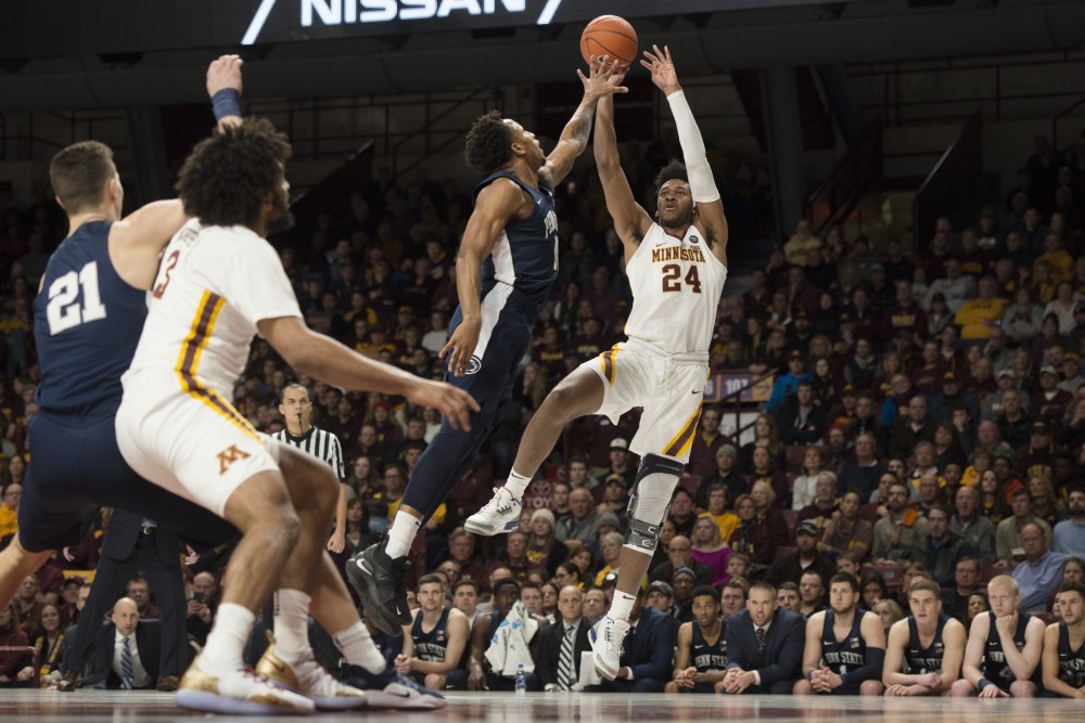 Forward Eric Curry shoots the ball at Williams Arena on Saturday, Jan. 19,2019. The Gophers defeated Penn State 65-64.