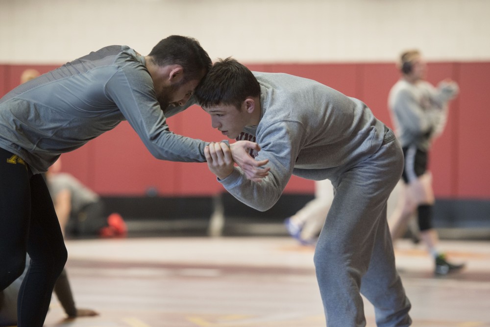 Mitch McKee warms up during practice at the new Gopher Wrestling Training Facility on Wednesday, Jan. 23. 
