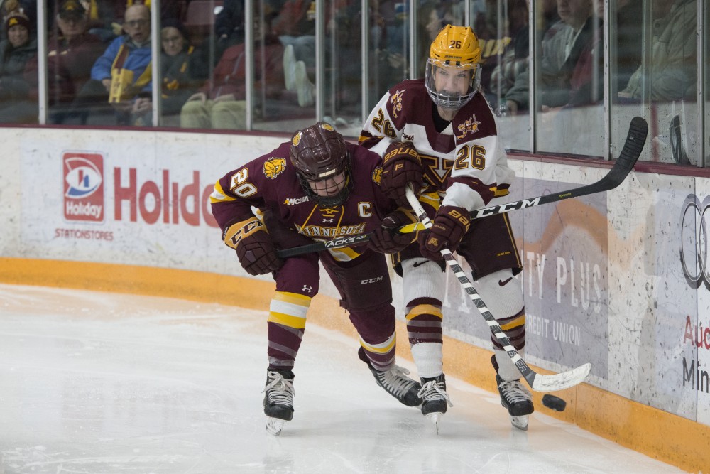 Forward Sarah Potomak fights for the puck at Ridder Arena on Saturday, Feb. 2. The Gophers lost to UMD in overtime 3-2. 