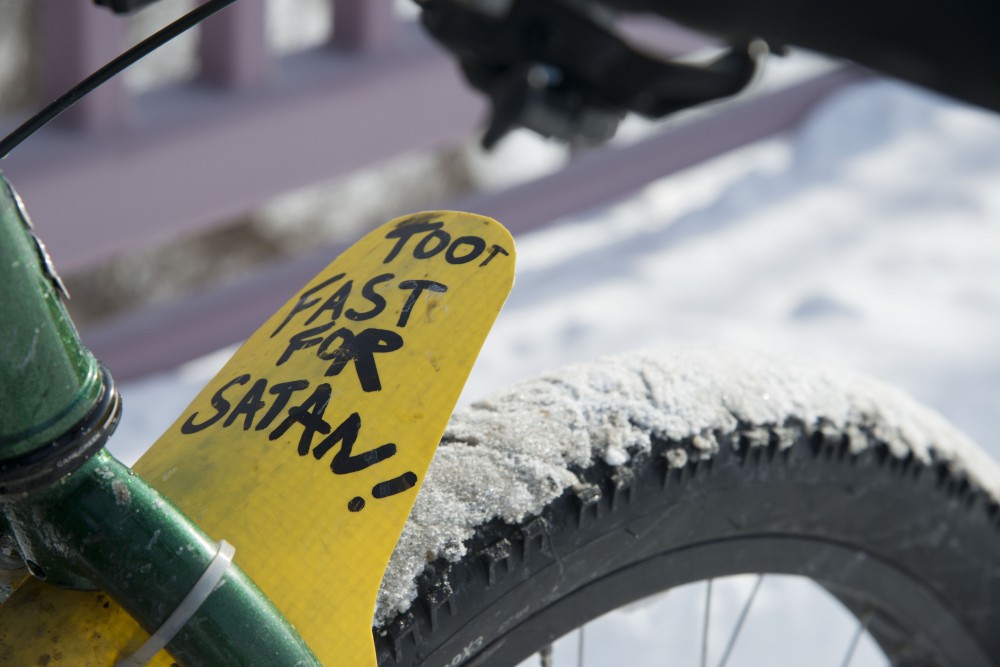 The fender of Bennett Figueroas bike reads, toot fast for Satan, on Friday, Feb.1