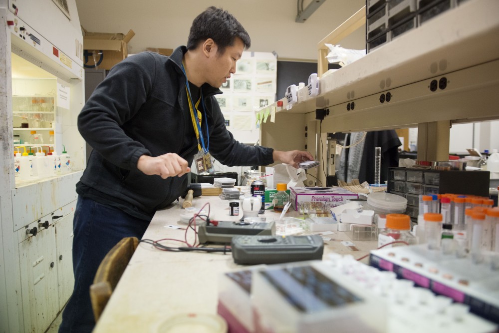 Ph.D. candidate Joseph Um works in the lab he uses for nano wire research on Tuesday, Feb. 12 in Keller Hall on the East Bank campus.