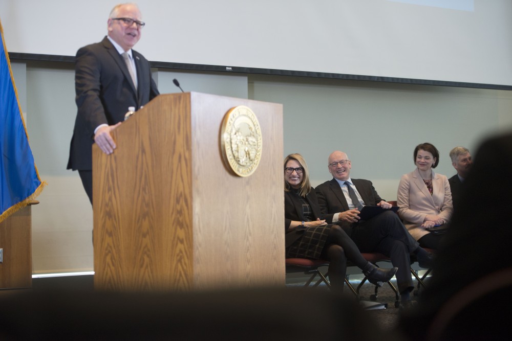 Lt. Gov. Peggy Flanagan smiles after Gov. Tim Walz spoke about paid paternity leave at the Minnesota Department of Revenue building on Tuesday, Feb. 19.