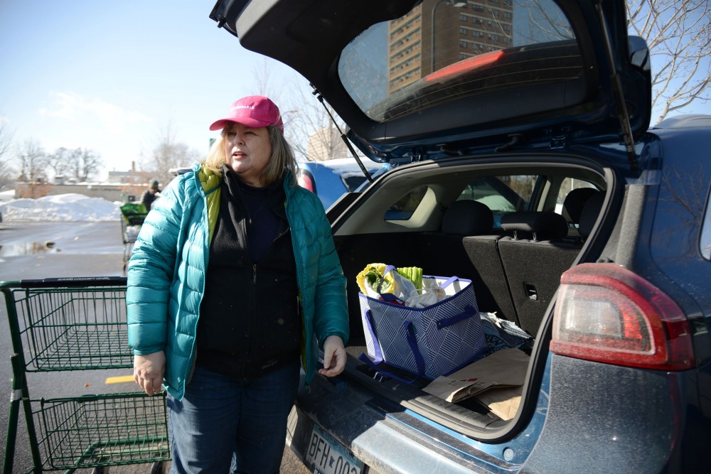 Allison Sandve loads her plastic-free groceries into her car on Sunday, Feb. 24 at the Seward Community Co-op in Minneapolis. Sandve started living a plastic-free lifestyle almost a year ago and plans to continue exploring ways to incorporate sustainability into her life.