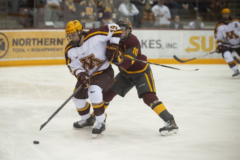 Sophomore Scott Reedy keeps the puck away from Arizona State on Friday, March 1 at 3M at Mariucci Arena. 