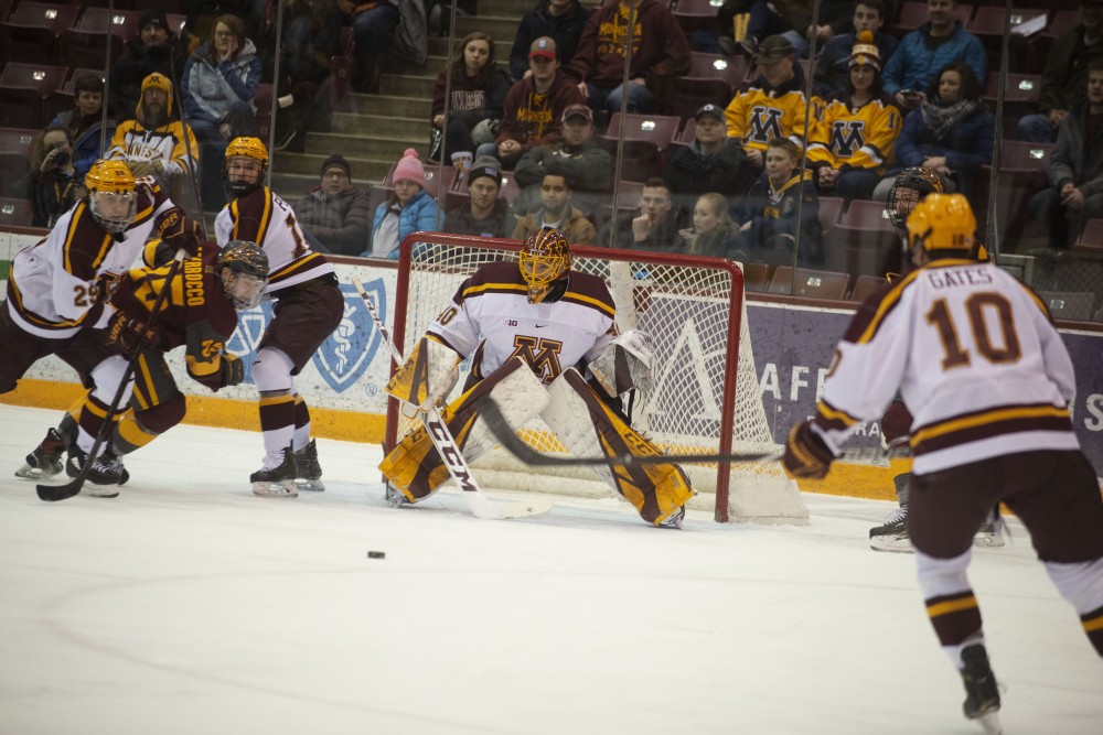 Mat Robson eyes the puck from the goal during the game against Arizona State on Friday, March 1, 2019 at 3M at Mariucci Arena.