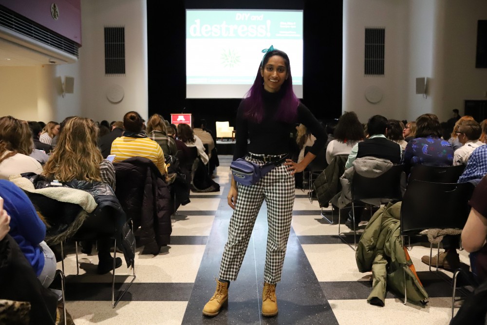 Senior Shalini Saravanan, a computer science student, wears a fanny pack before Tan France speaks at Coffman Union.