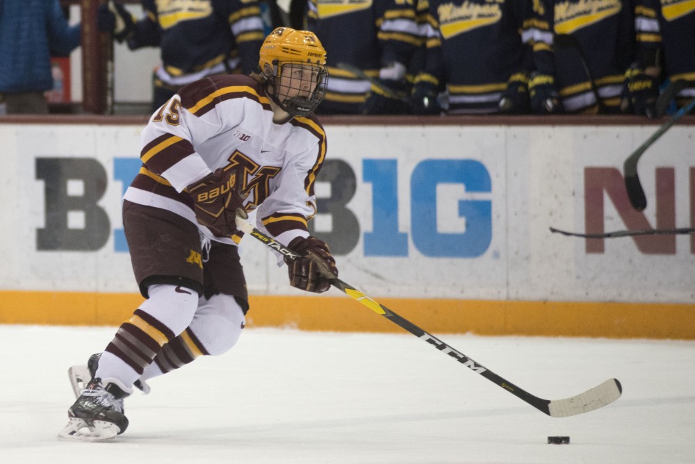 Junior Rem Pitlick skates with the puck on Friday, March 8 at Mariucci Arena in Minneapolis. 