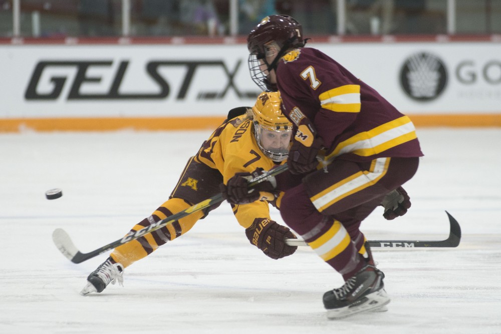 Forward Taylor Williamson reaches for the puck on Saturday, March 9 at Ridder Arena. The Gophers defeated Minnesota Duluth 4-1 to advance in the WCHA Final Faceoff. 
