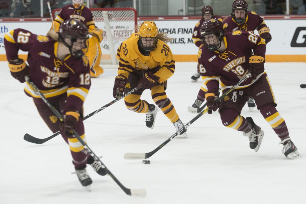 Forward Alex Woken chases after the Bulldogs on Saturday, March 9 at Ridder Arena. The Gophers defeated Minnesota Duluth 4-1 to advance in the WCHA Final Faceoff. 