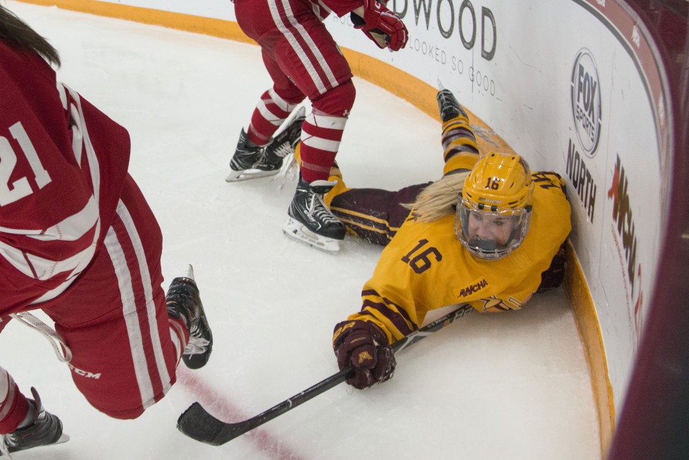Forward Amy Potomak dives for the puck at Ridder Arena on Sunday, March 10. 